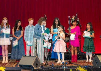 Anya Hu and Julie Hughes on stage at the Wildflower! Budding Talent Vocal Competition in Richardson